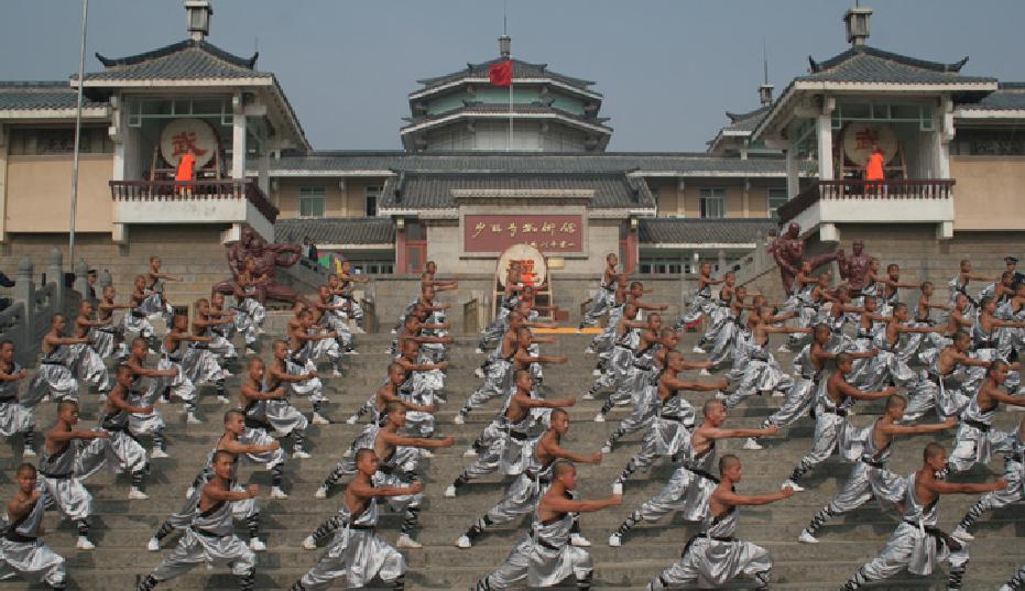 the image shows disciples doing kung fu at the Shaolin Wushu Academy